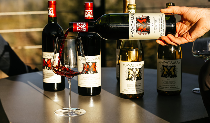 Several bottles of Mayacamas wine on a table