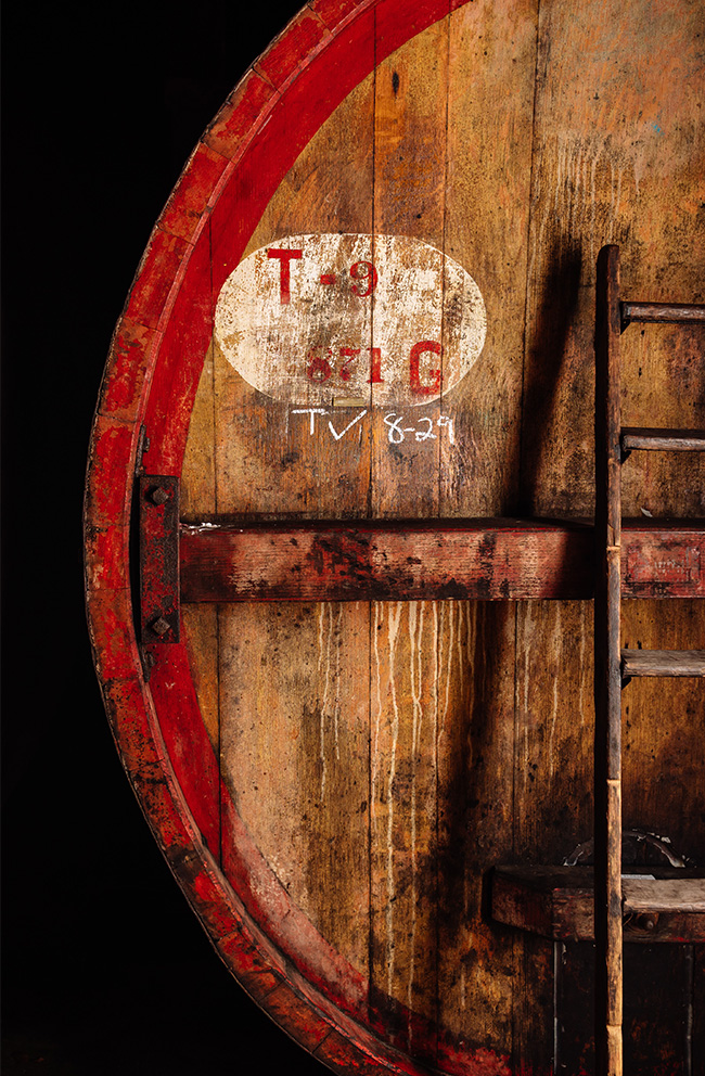 Closeup of large wooden barrel with ladder