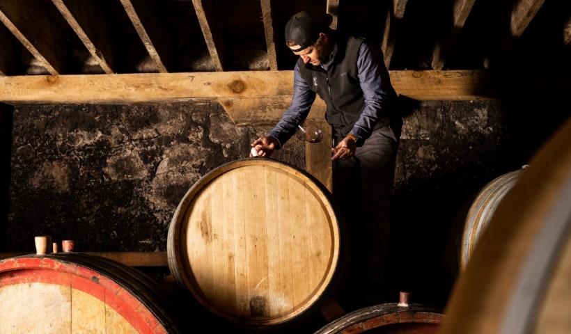 Mayacamas winemaker testing red wine from barrel