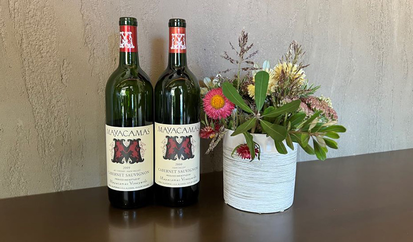 Two Bottles of Mayacamas wine next to potted plannt