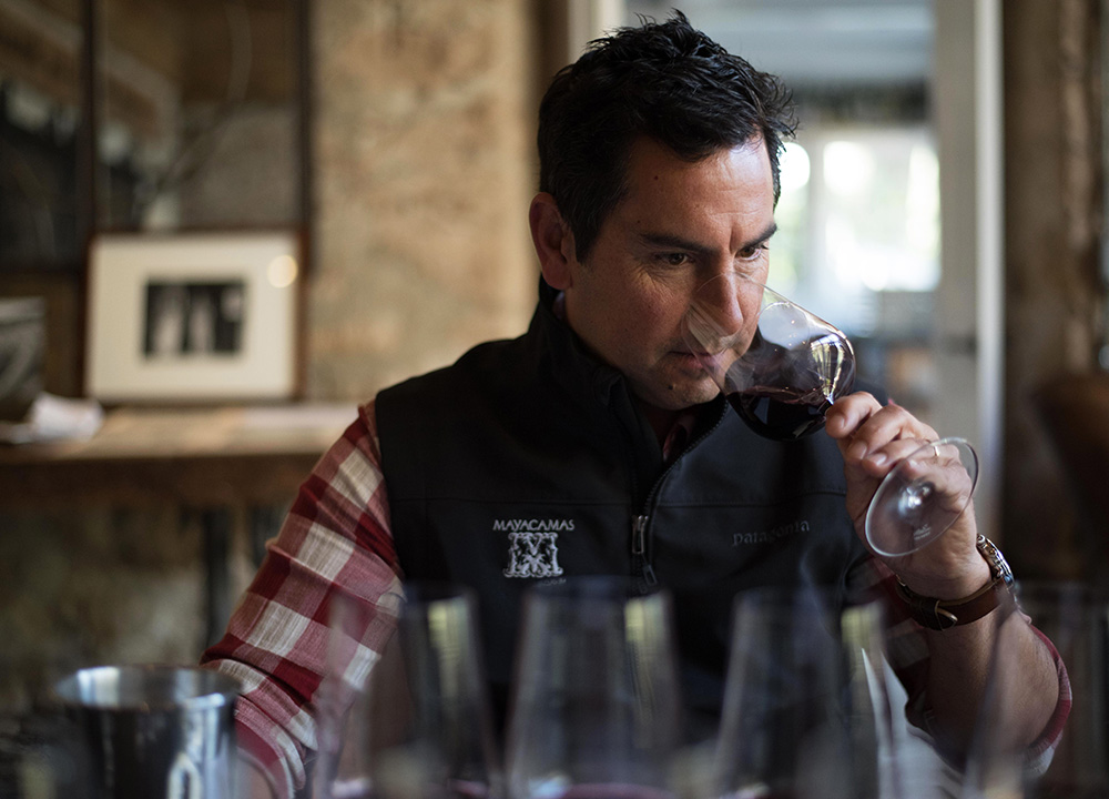 Winemaker smelling red wine in a glass