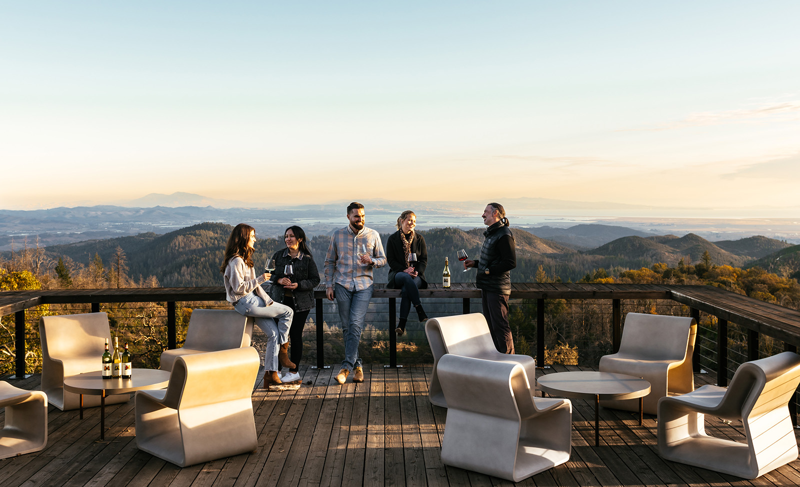 Group of 5 people drinking wine on Mayacamas deck